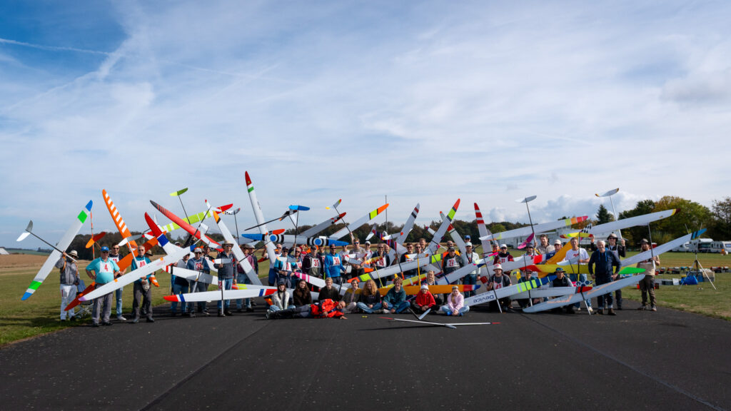All competitore and helpers of the competition on the runway of the airfield